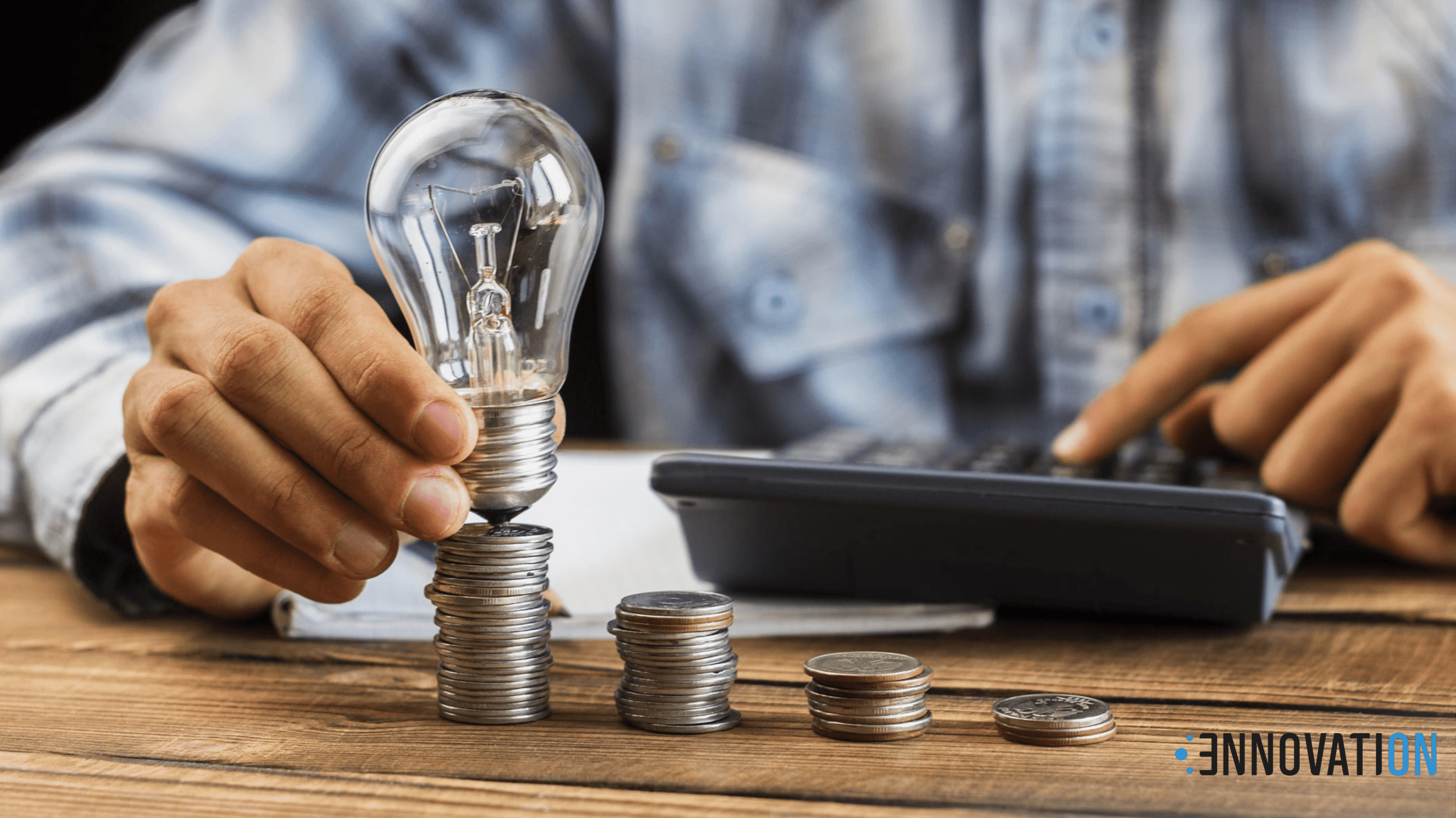 a light bulb and someone calculating electricity billing